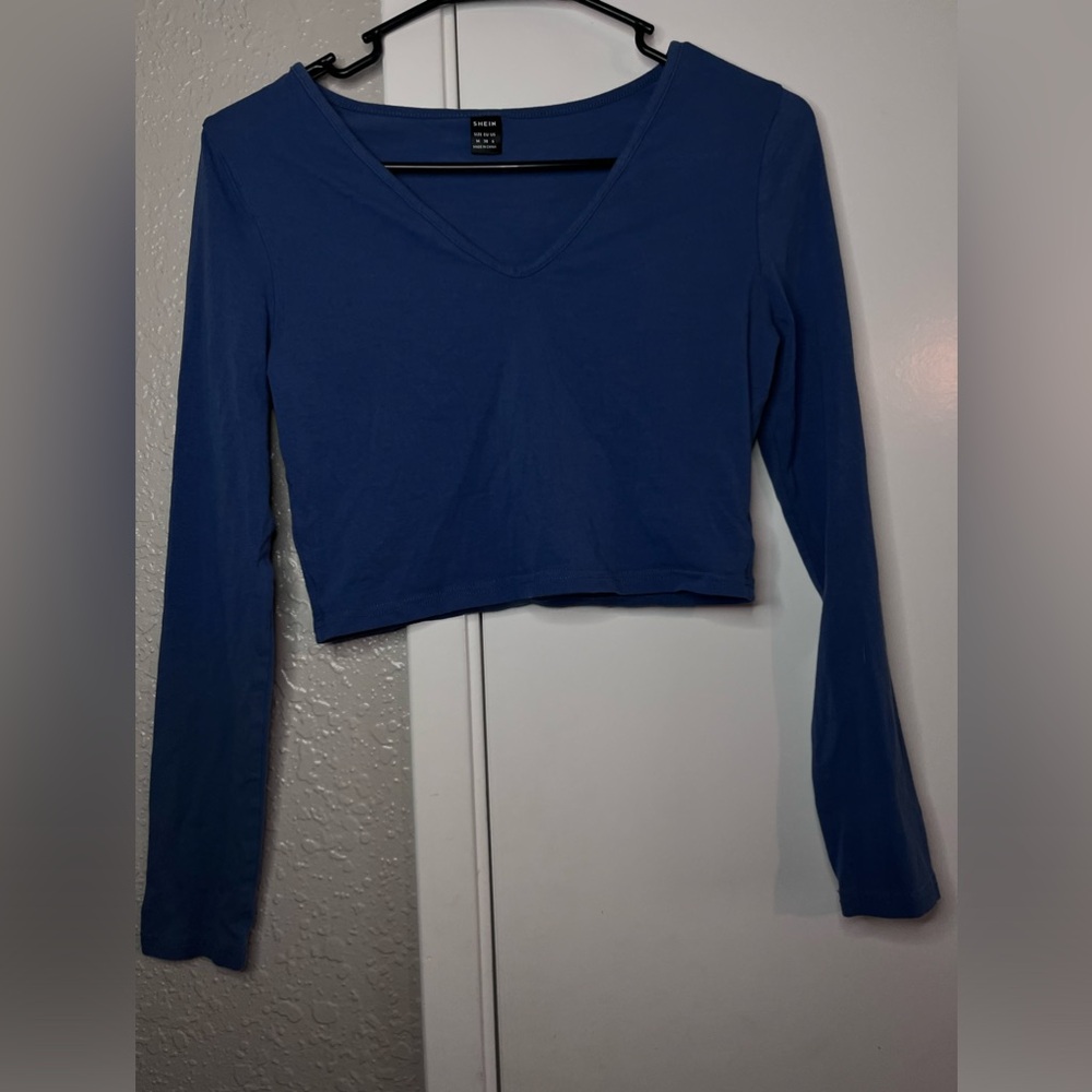 Blue long sleeve crop top.